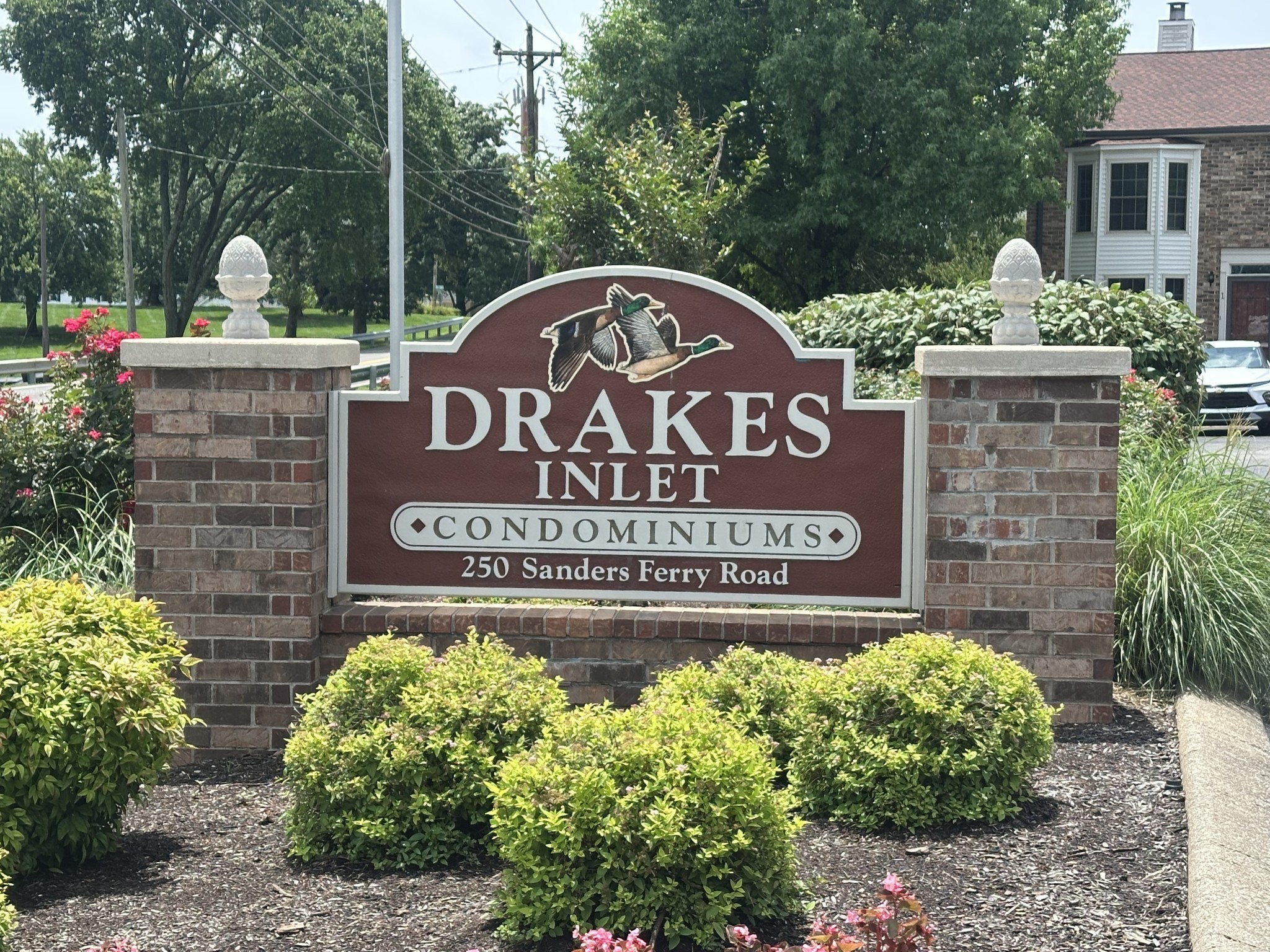 250 Sanders Ferry Road, Unit 34 Hendersonville, TN 37075 - Photo 21 of 21 a sign that is sitting in front of flowers