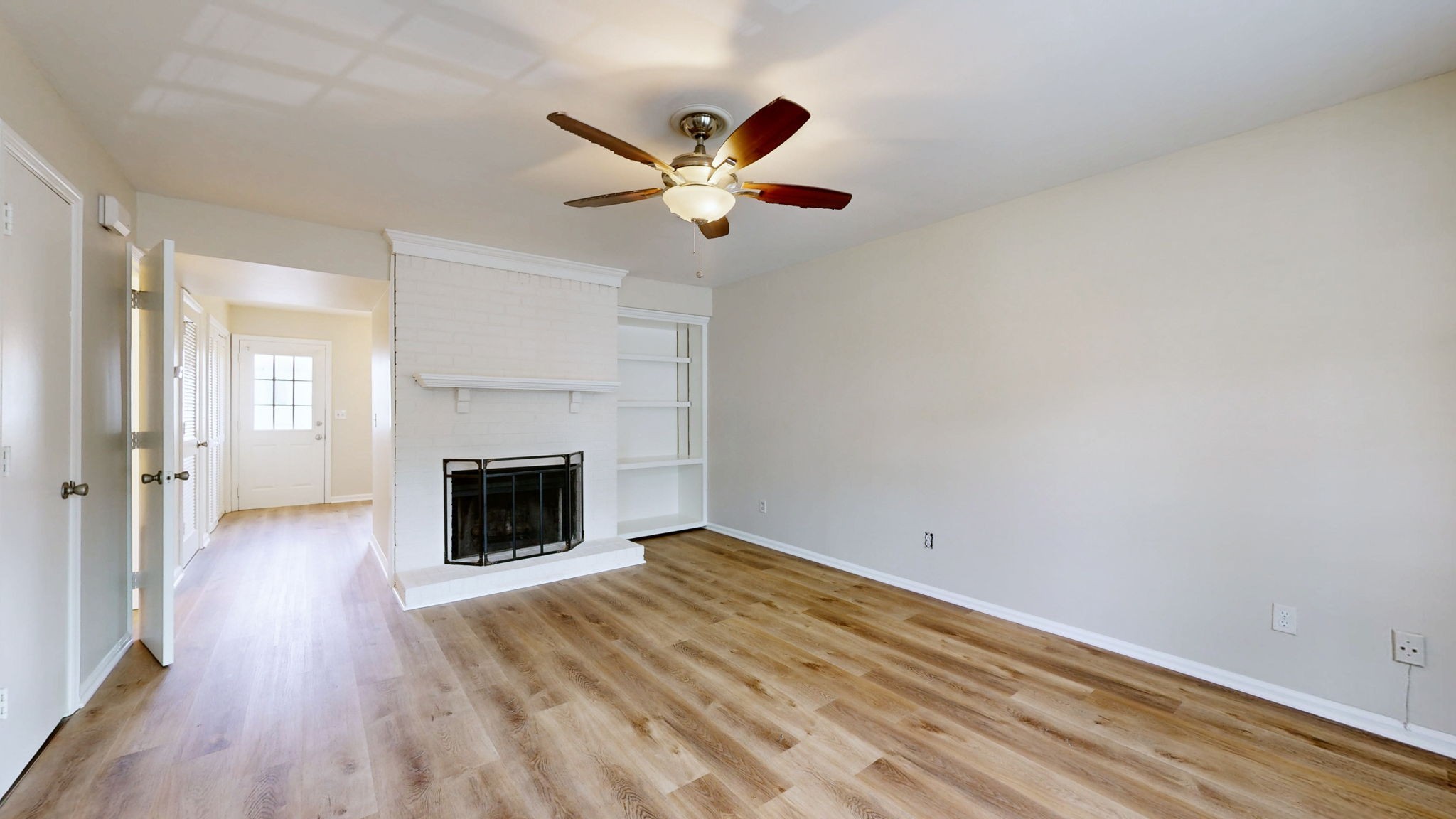 250 Sanders Ferry Road, Unit 34 Hendersonville, TN 37075 - Photo 5 of 21 wooden floor in an empty room with a fireplace
