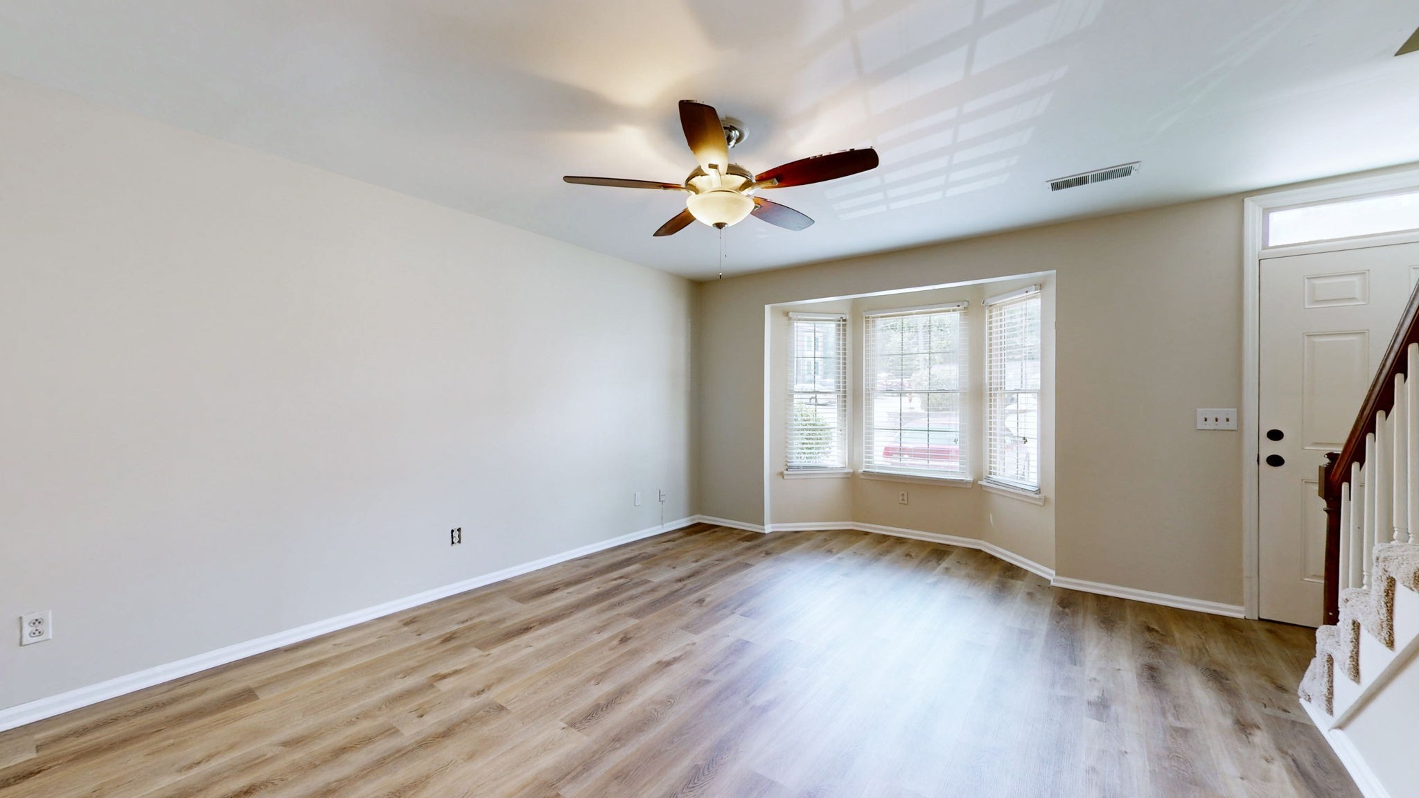 250 Sanders Ferry Road, Unit 34 Hendersonville, TN 37075 - Photo 6 of 21 an empty room with wooden floor fan and windows