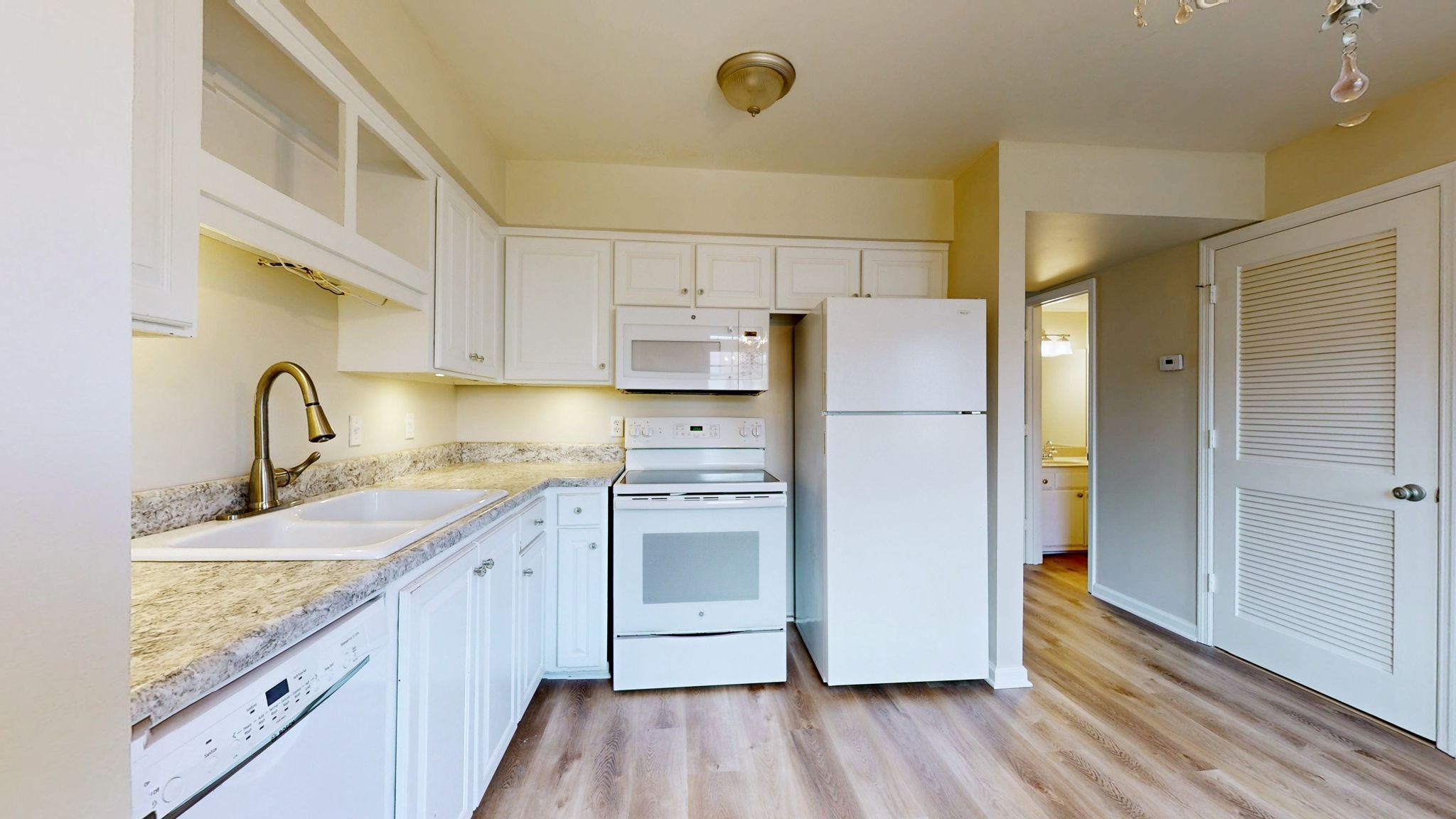 250 Sanders Ferry Road, Unit 34 Hendersonville, TN 37075 - Photo 8 of 21 a kitchen with a refrigerator sink and cabinets