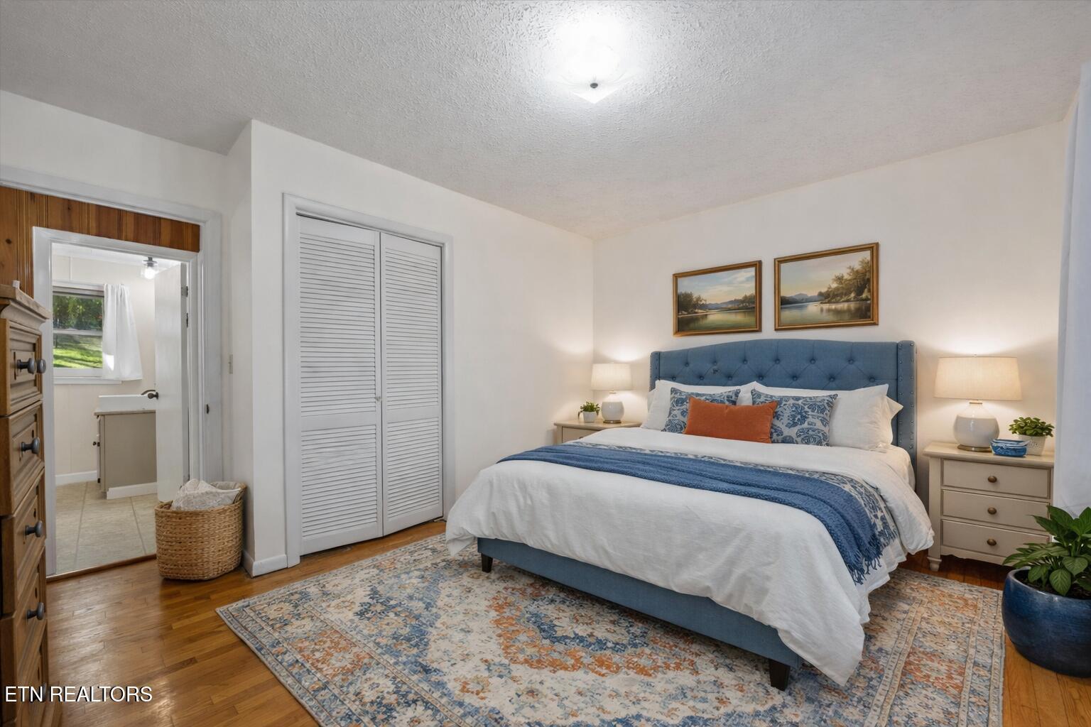 8237 Collier Road Powell, TN 37849 - Photo 14 of 31 Cozy bedroom with serene landscape decor