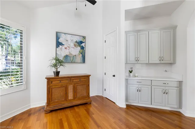 a view of a room with wooden floor and cabinet