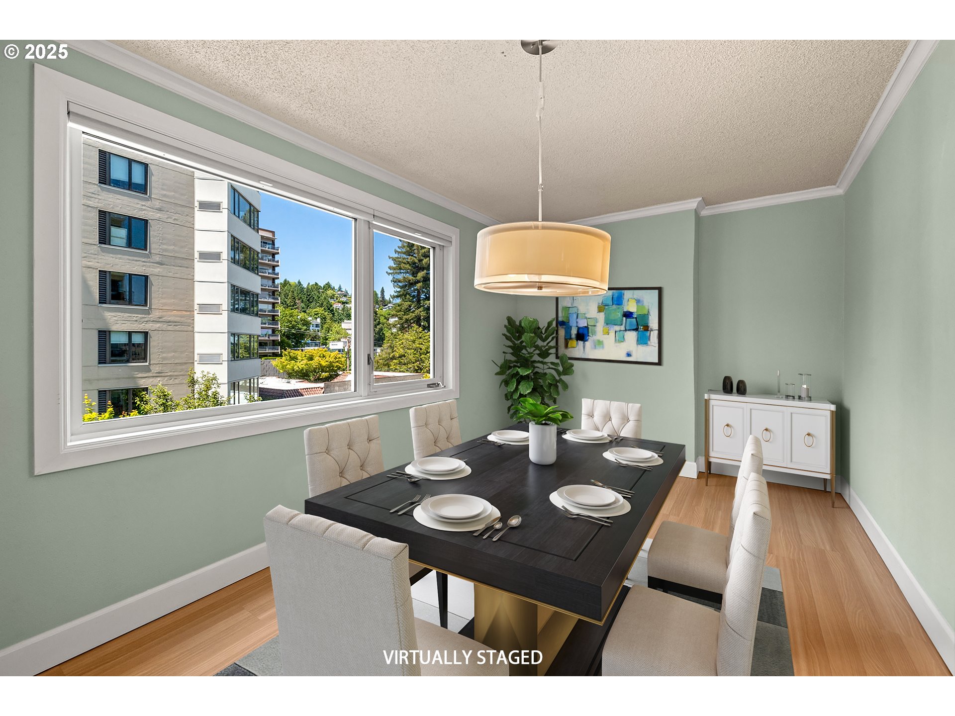 2211 Southwest Park Place, Unit 603 Portland, OR 97205 - Photo 11 of 27 a view of a dining room with a table and chairs