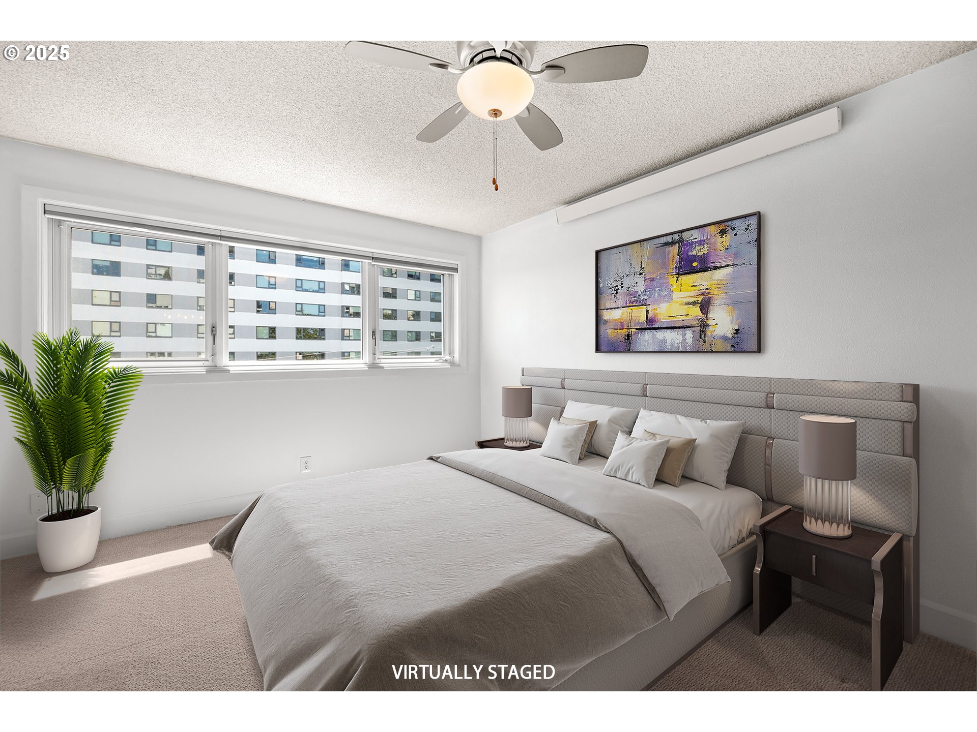 2211 Southwest Park Place, Unit 603 Portland, OR 97205 - Photo 17 of 27 a bedroom with a bed and a chandelier