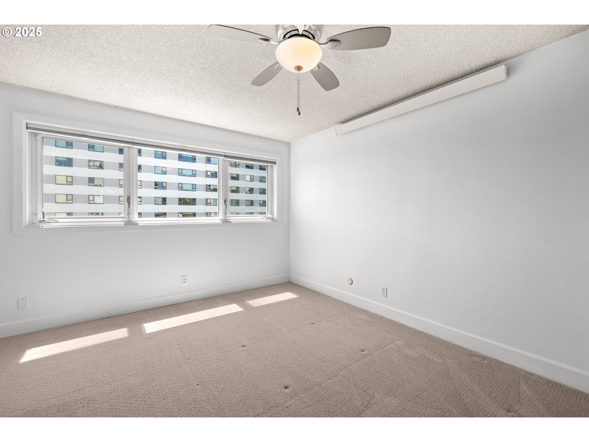 2211 Southwest Park Place, Unit 603 Portland, OR 97205 - Photo 18 of 27 a view of an empty room with a window