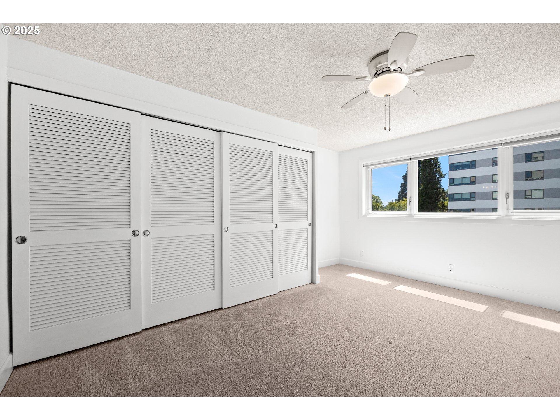 2211 Southwest Park Place, Unit 603 Portland, OR 97205 - Photo 19 of 27 a view of an empty room with a window