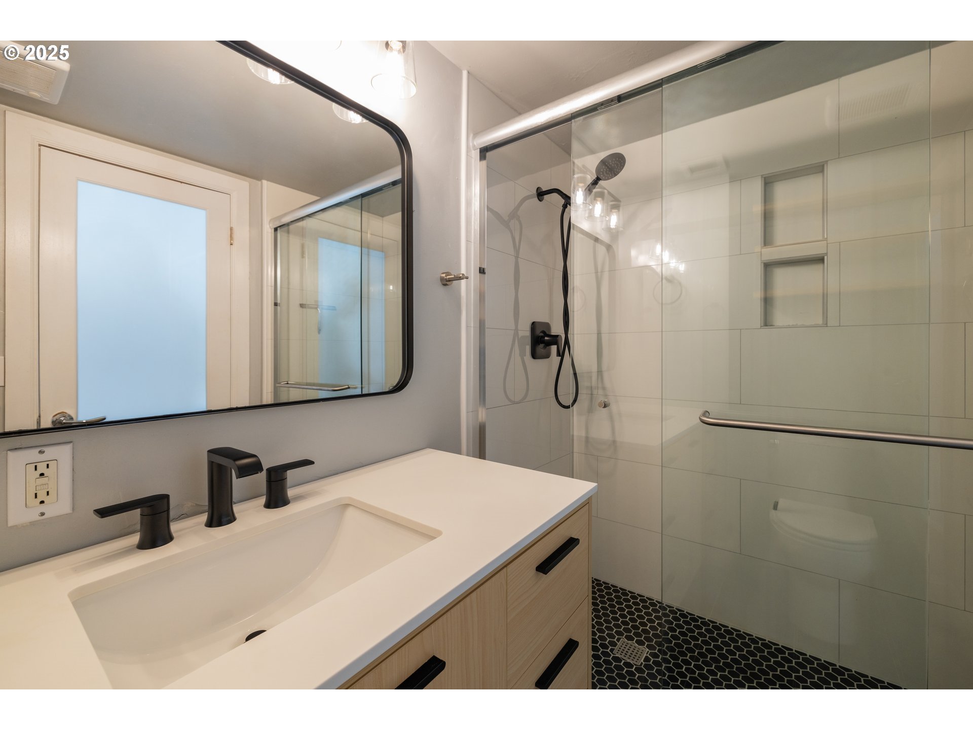 2211 Southwest Park Place, Unit 603 Portland, OR 97205 - Photo 21 of 27 a bathroom with a sink and a mirror