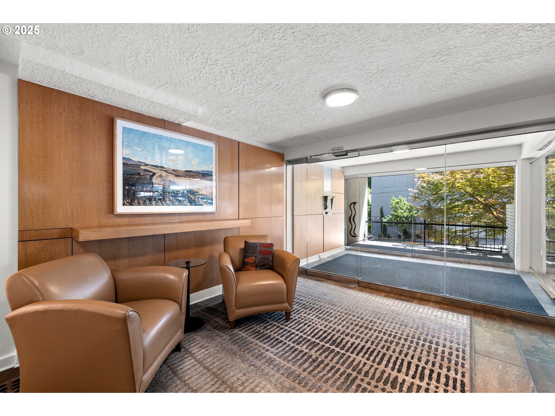 2211 Southwest Park Place, Unit 603 Portland, OR 97205 - Photo 5 of 27 a living room with furniture and a large window