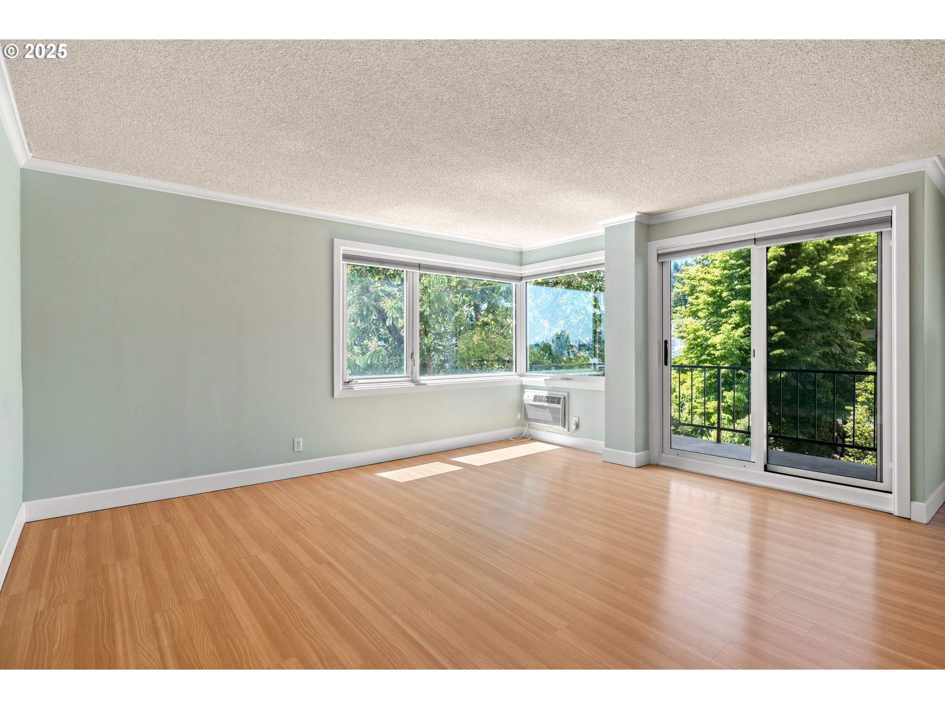 2211 Southwest Park Place, Unit 603 Portland, OR 97205 - Photo 7 of 27 a view of an empty room with wooden floor and a window