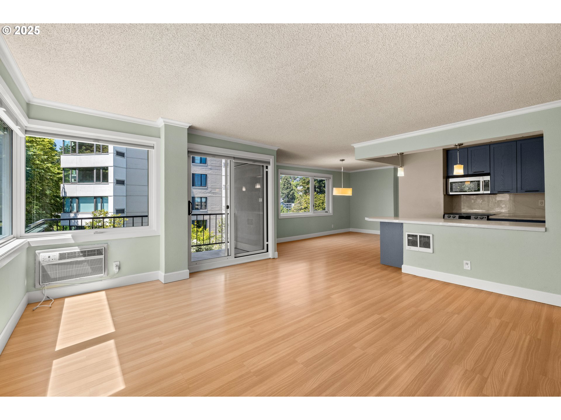 2211 Southwest Park Place, Unit 603 Portland, OR 97205 - Photo 8 of 27 a view of kitchen with furniture and wooden floor