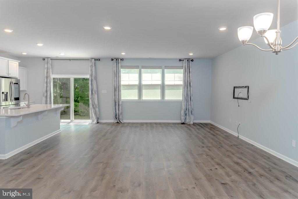 70 Morley Boulevard Medford, NJ 08055 - Photo 14 of 32 an empty room with wooden floor and windows