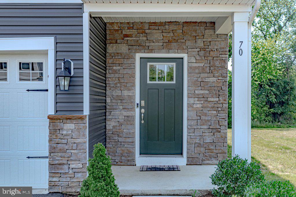 70 Morley Boulevard Medford, NJ 08055 - Photo 2 of 32 a front view of a house with a garden