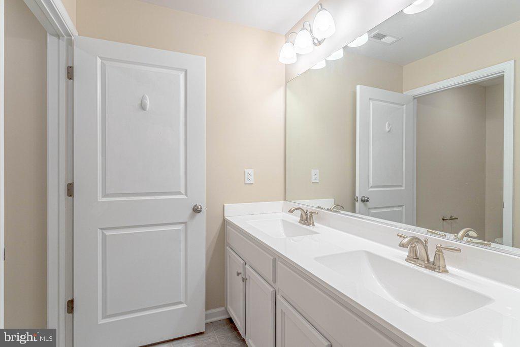 70 Morley Boulevard Medford, NJ 08055 - Photo 22 of 32 a bathroom with a sink a mirror and a shower