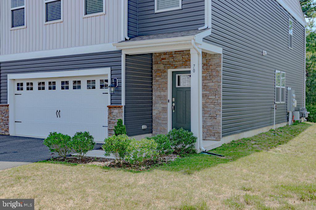 70 Morley Boulevard Medford, NJ 08055 - Photo 3 of 32 a front view of a house with garden