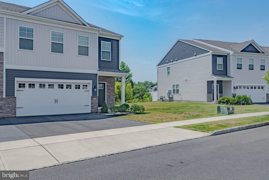 70 Morley Boulevard Medford, NJ 08055 - Photo 6 of 32 a view of a house with a yard and garage