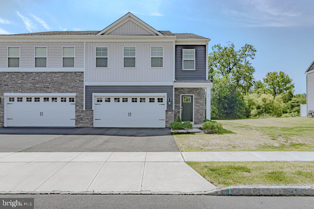 70 Morley Boulevard Medford, NJ 08055 - Photo 7 of 32 a view of a white house with a yard and a large tree