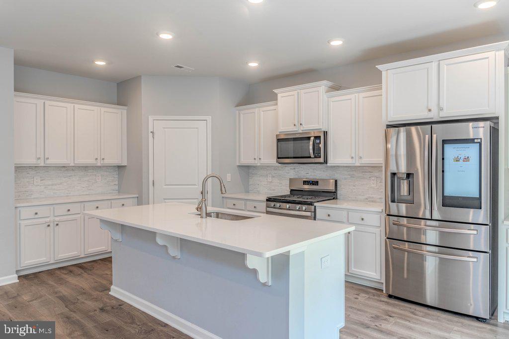 70 Morley Boulevard Medford, NJ 08055 - Photo 10 of 32 a kitchen with cabinets stainless steel appliances and a counter space