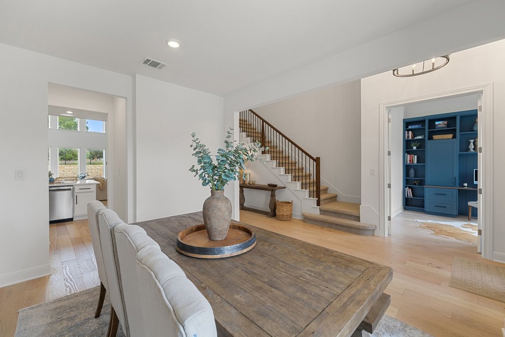 365 Pear Tree Lane Austin, TX 78737 - Photo 7 of 39 a view of a dining room with furniture and wooden floor