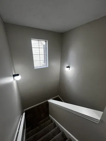 a bathroom with a sink a toilet a mirror and a bathtub