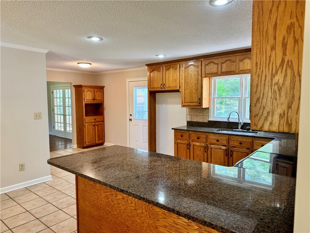 999 Grassdale Road Northwest Cartersville, GA 30121 - Photo 16 of 54 a kitchen with stainless steel appliances granite countertop wooden cabinets and a granite counter tops