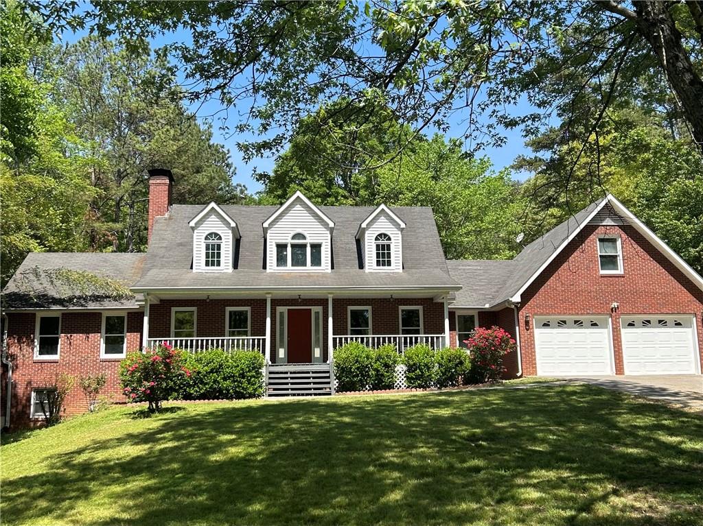 999 Grassdale Road Northwest Cartersville, GA 30121 - Photo 2 of 54 a front view of a house with a yard
