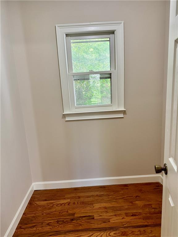 999 Grassdale Road Northwest Cartersville, GA 30121 - Photo 24 of 54 a view of a room with wooden floor and a window