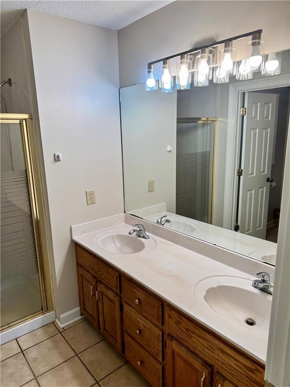 999 Grassdale Road Northwest Cartersville, GA 30121 - Photo 25 of 54 a bathroom with a sink and a mirror