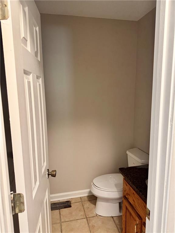 999 Grassdale Road Northwest Cartersville, GA 30121 - Photo 28 of 54 a white toilet sitting next to a shower curtain