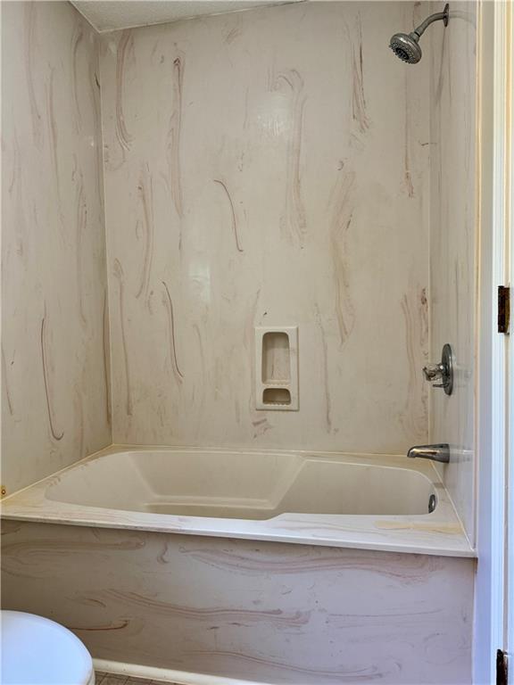 999 Grassdale Road Northwest Cartersville, GA 30121 - Photo 35 of 54 a bathroom with a bathtub and a shower