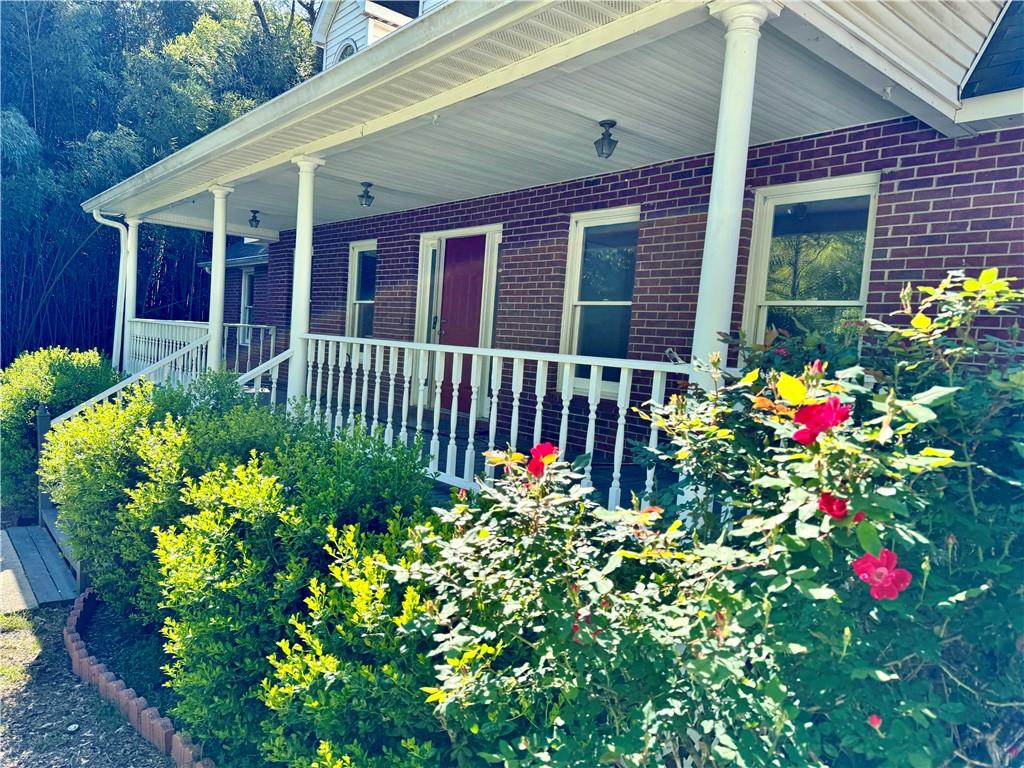 999 Grassdale Road Northwest Cartersville, GA 30121 - Photo 6 of 54 a front view of a house with lots of flower and flowers