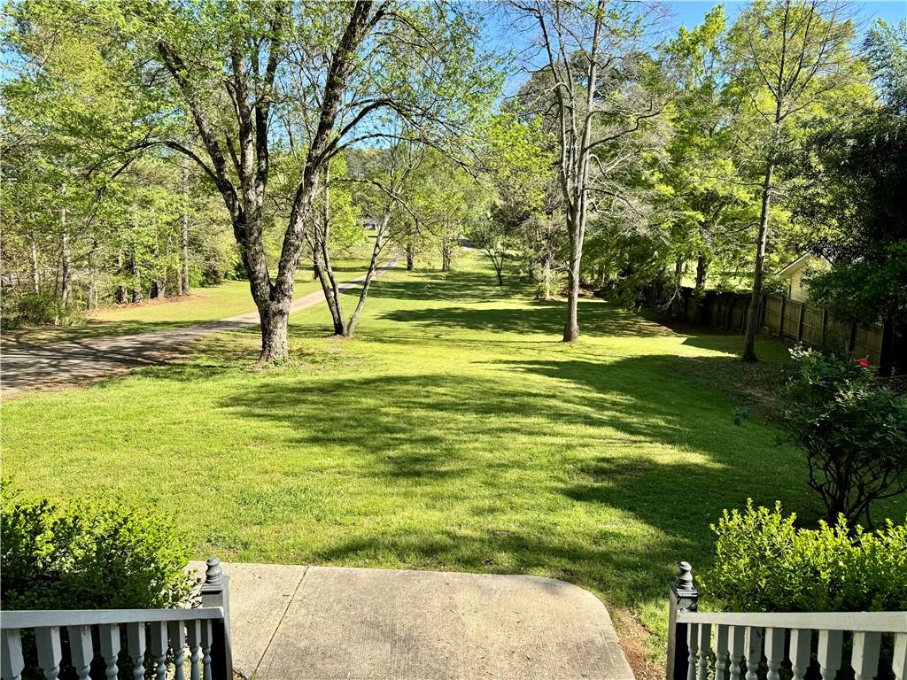 999 Grassdale Road Northwest Cartersville, GA 30121 - Photo 7 of 54 a swimming pool with wooden fence