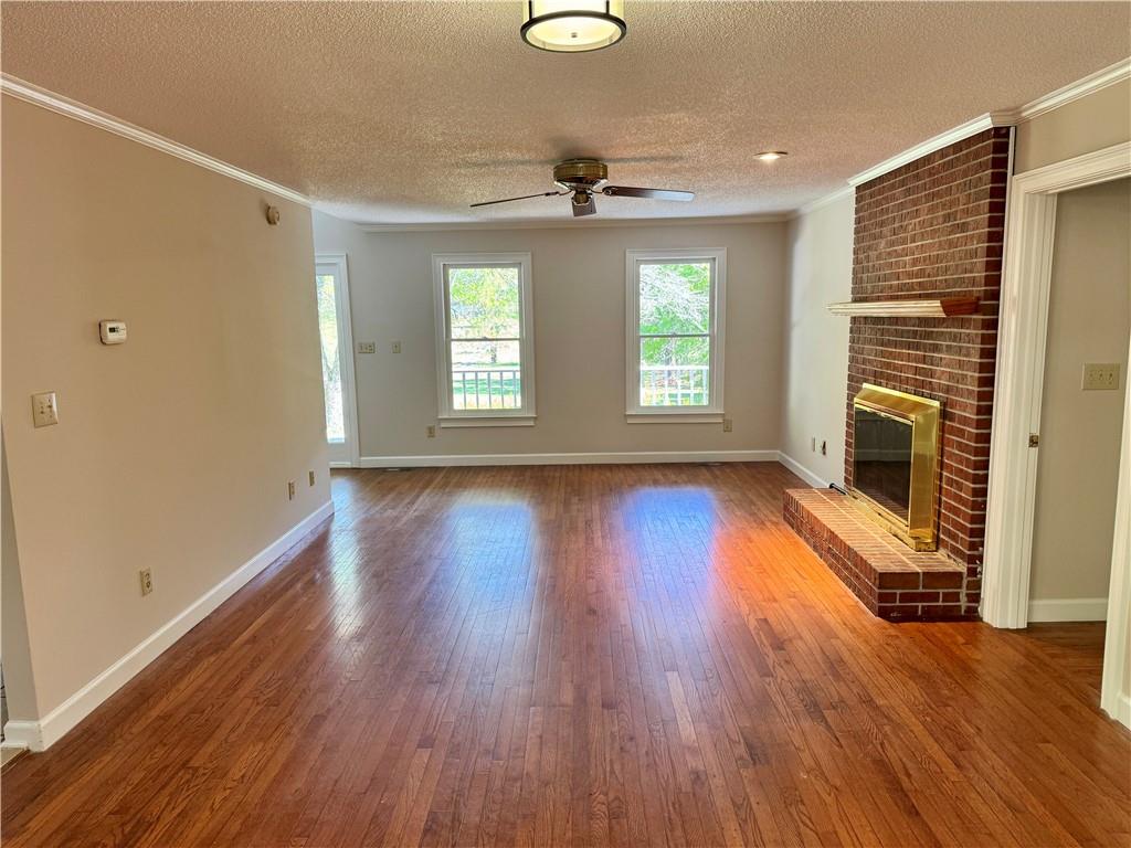 999 Grassdale Road Northwest Cartersville, GA 30121 - Photo 9 of 54 a view of empty room with wooden floor and fan