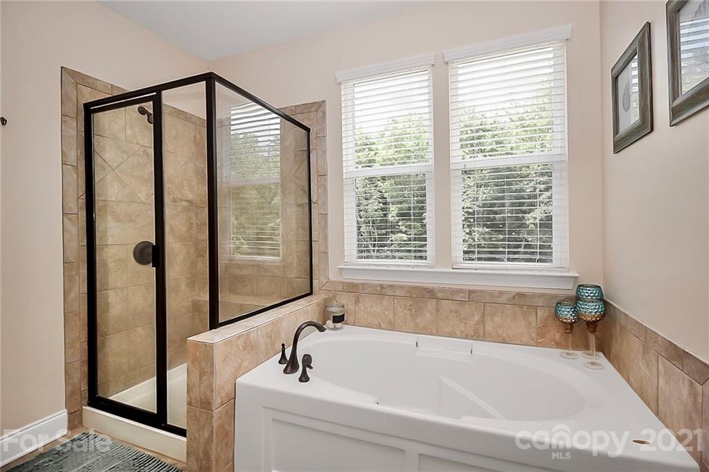 6012 Fallondale Road Waxhaw, NC 28173 - Photo 22 of 45 a bathroom with a bathtub and a shower