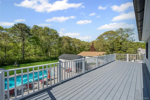 a view of a balcony with wooden floor