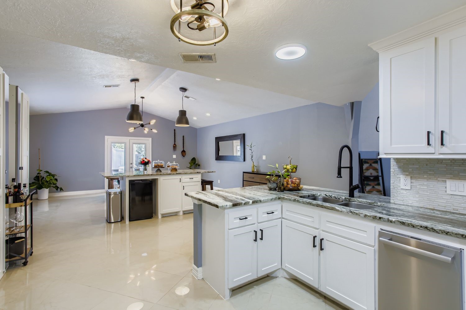 16614 Creeksouth Road Houston, TX 77068 - Photo 12 of 36 a kitchen with a sink cabinets and window