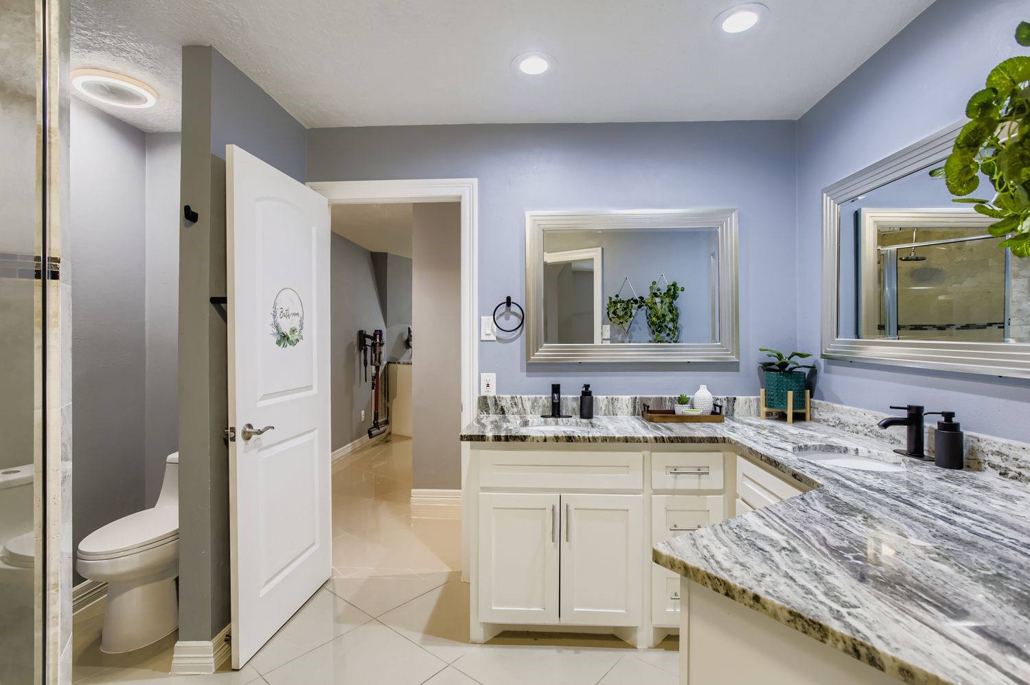 16614 Creeksouth Road Houston, TX 77068 - Photo 16 of 36 a spacious bathroom with a granite countertop sink toilet and shower