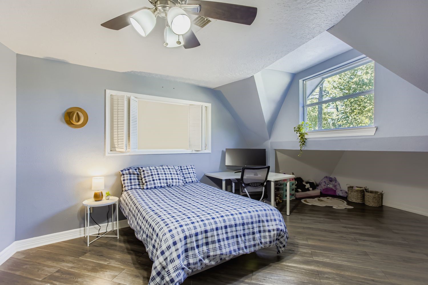 16614 Creeksouth Road Houston, TX 77068 - Photo 18 of 36 a bedroom with a bed and a chandelier