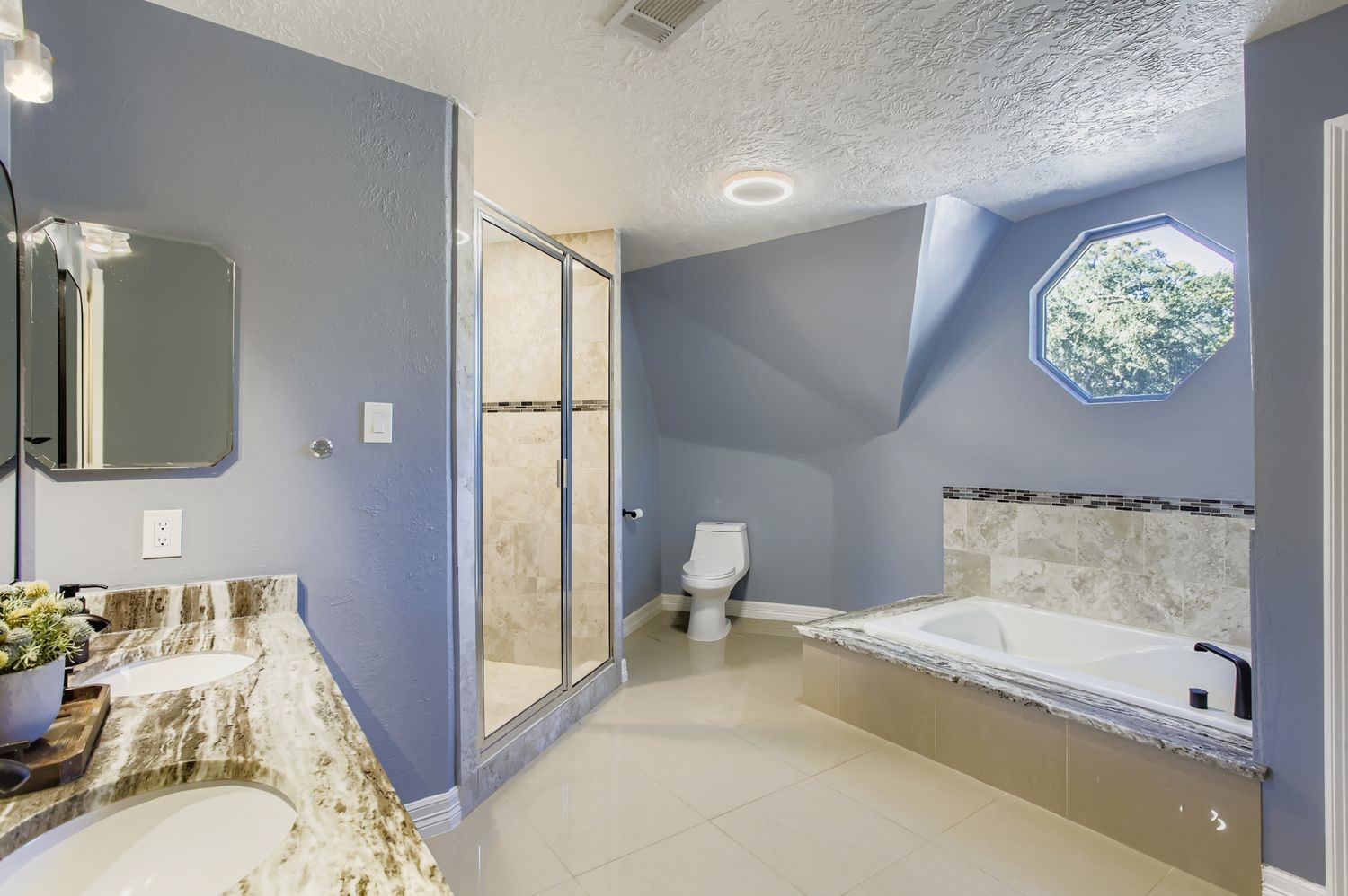 16614 Creeksouth Road Houston, TX 77068 - Photo 20 of 36 a bathroom with a sink and a mirror