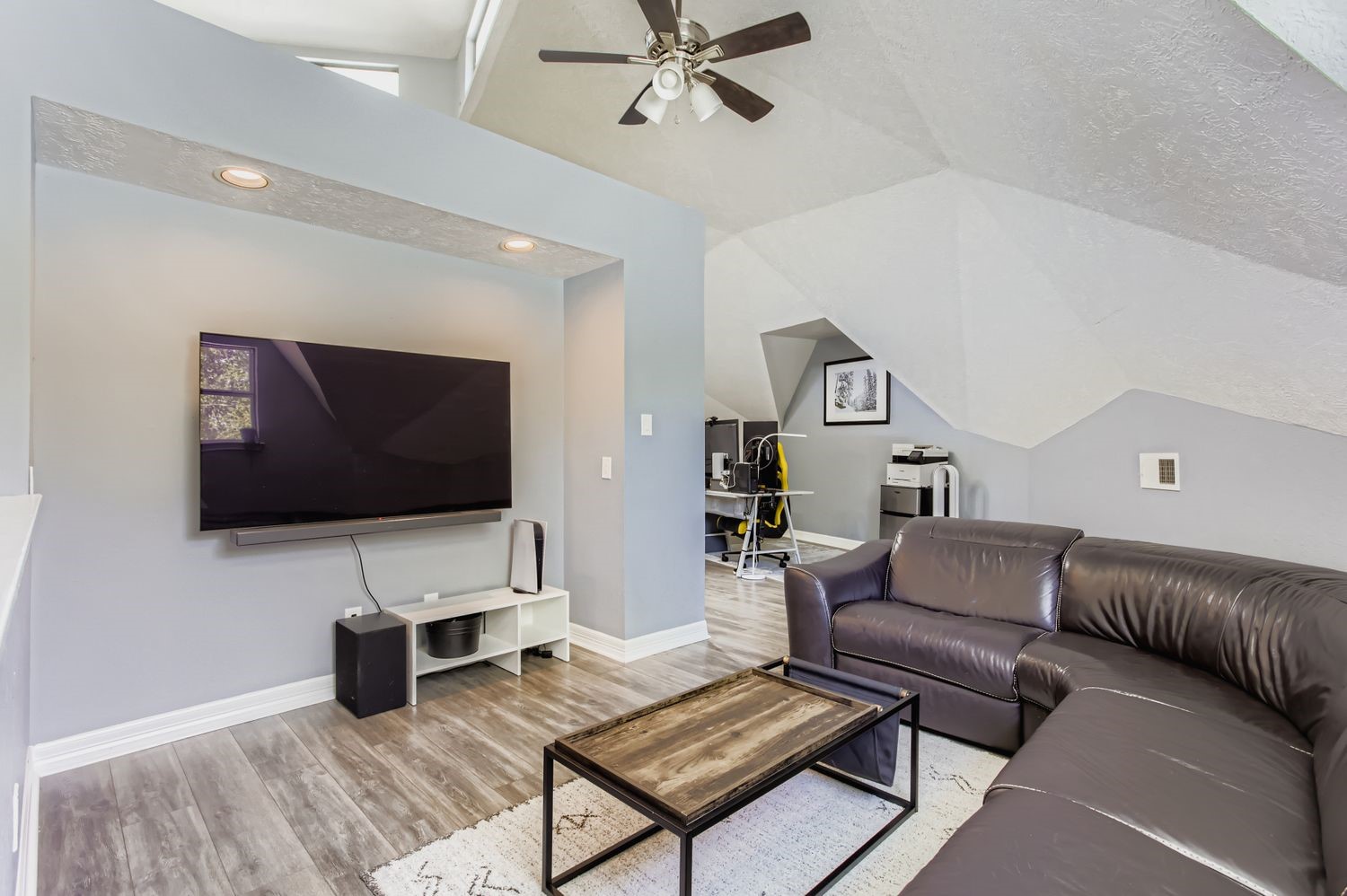 16614 Creeksouth Road Houston, TX 77068 - Photo 24 of 36 a living room with furniture and a flat screen tv