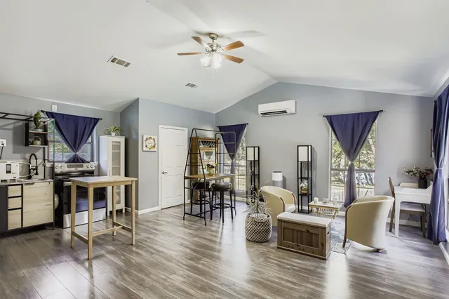 a bathroom with a granite countertop sink mirror and vanity