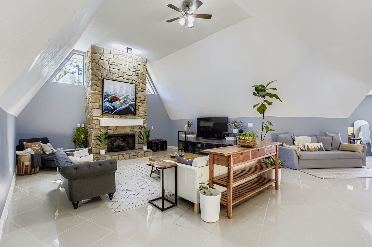 16614 Creeksouth Road Houston, TX 77068 - Photo 6 of 36 a living room with furniture a fireplace and a flat screen tv