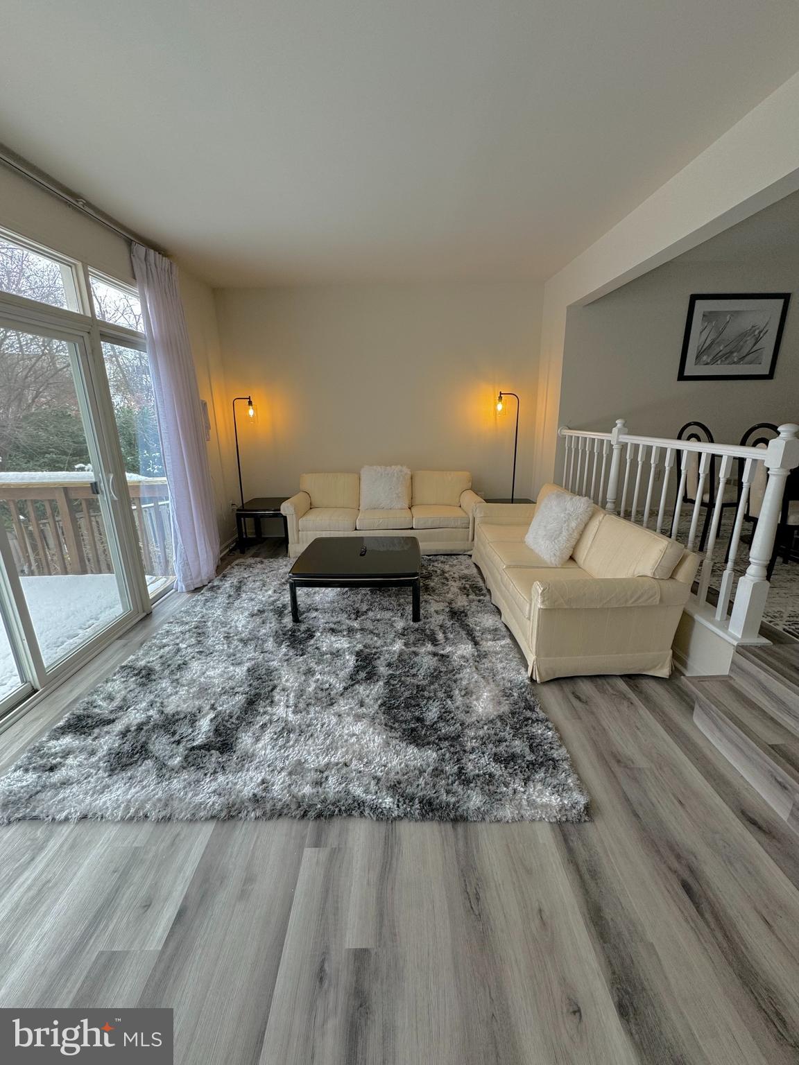 10946 Rampart Way Silver Spring, MD 20902 - Photo 11 of 11 a living room with furniture and a fireplace