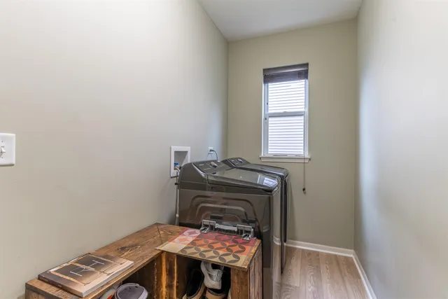 a room with a stove and wooden floor