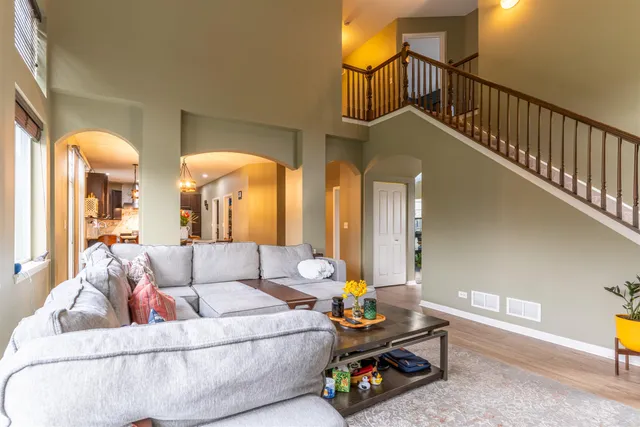 a living room with furniture and a table