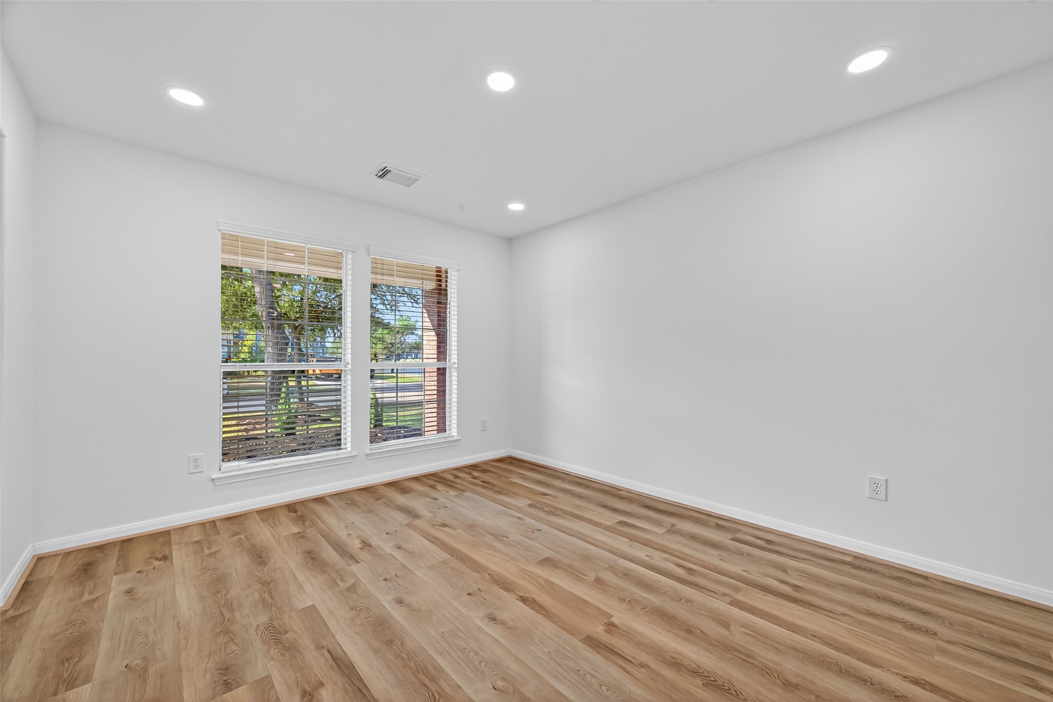 17422 Bending Post Drive Houston, TX 77095 - Photo 9 of 50 a view of an empty room with wooden floor and a window
