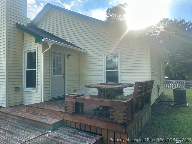 a view of a park with large trees