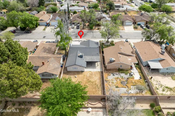 an aerial view of residential houses with outdoor space