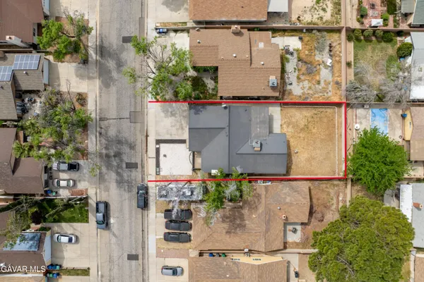 aerial view of a houses with street
