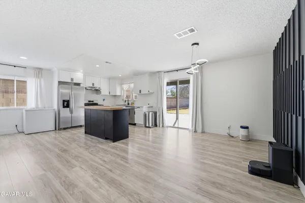 a view of kitchen with wooden floor and window