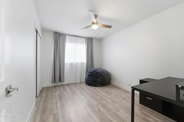 a room with a window and a wooden floor